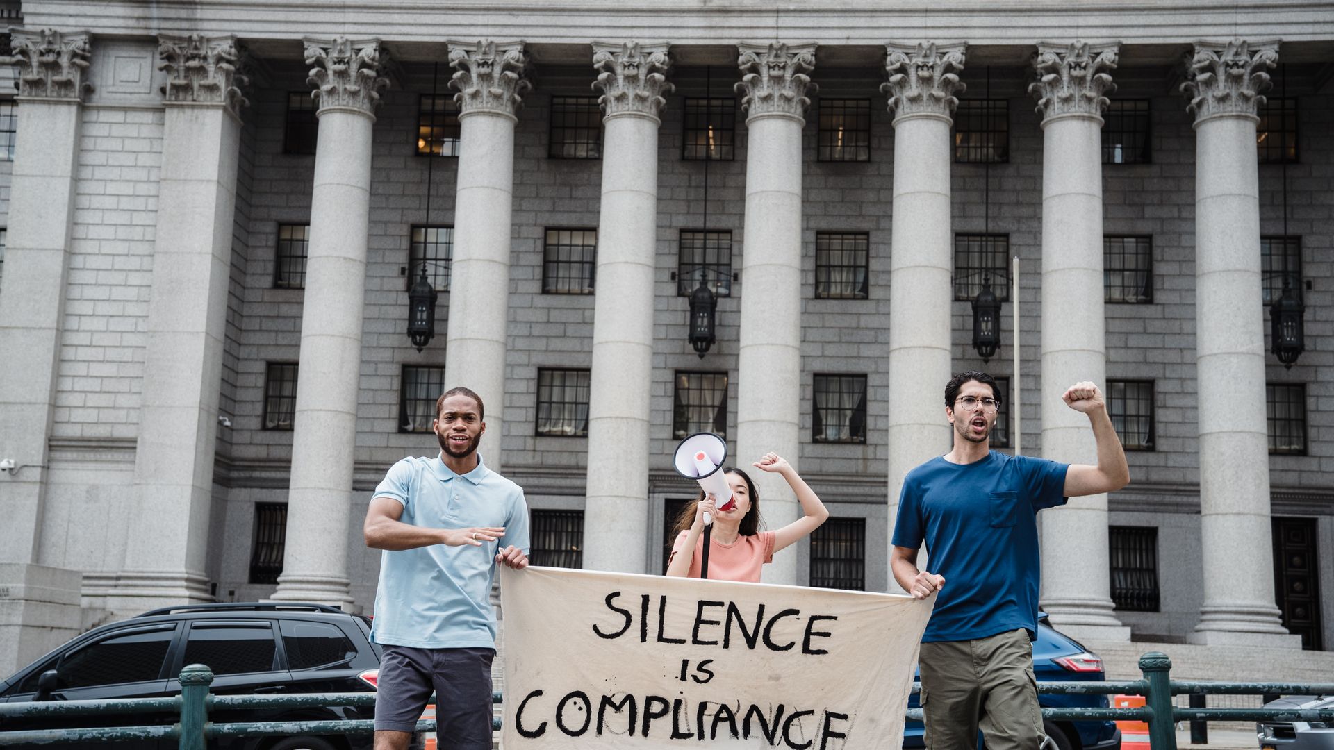 Modafinil Legal Status USA: Understanding the Rules Three protesters with a 'Silence is Compliance' banner in front of a courthouse — modafinil legal status USA