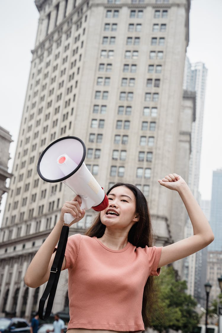 Female Protester Holding A Megaphone 