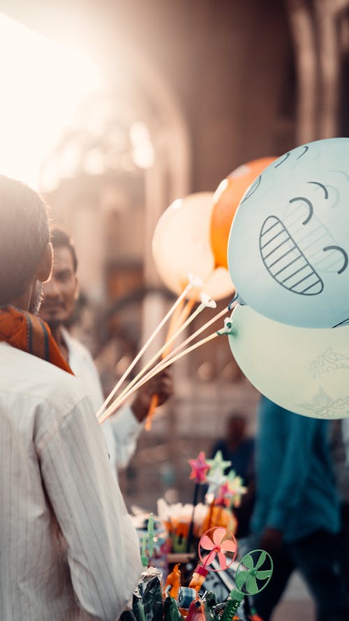 Free Person holding Balloons  Stock Photo