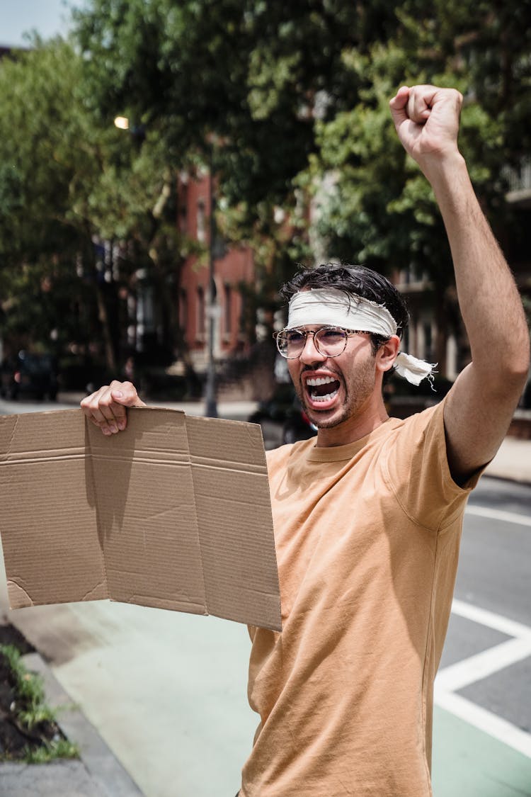 Man Holding A Blank Cardboard