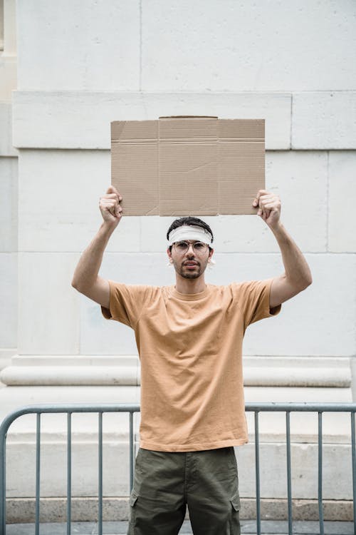 Man holding a Blank Cardboard
