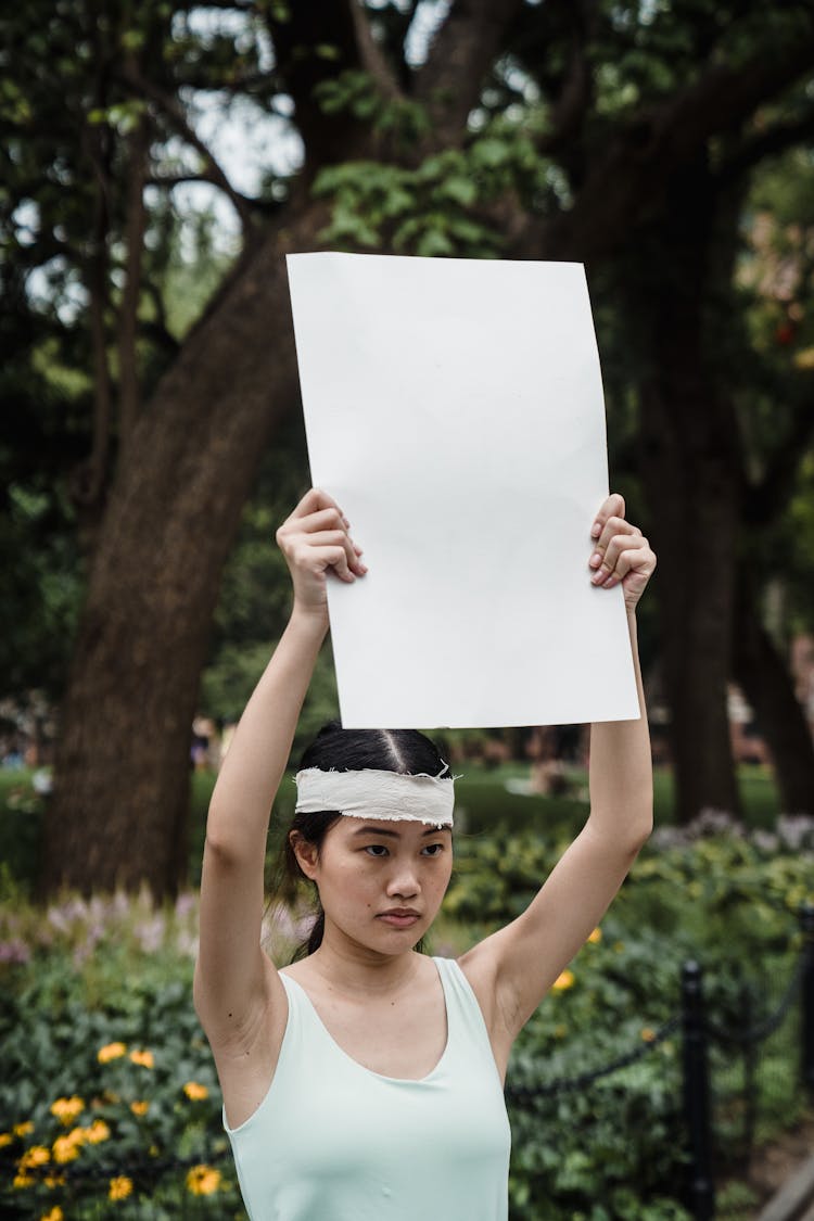 Man Holding A Blank Cardboard