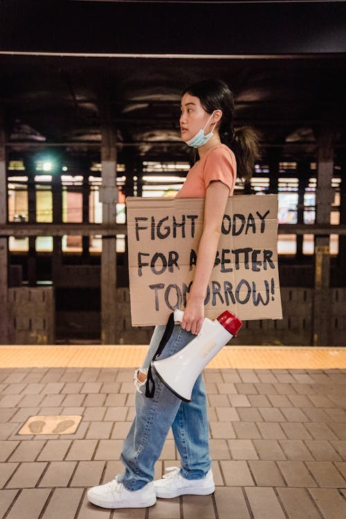 Woman holding a Slogan 