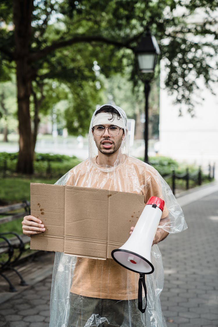 Man Holding A Blank Placard 