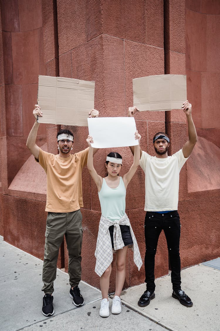 People With Mockup Posters On Street Demonstration 