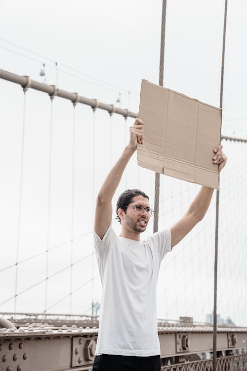 Man with Poster on Bridge on Demonstration