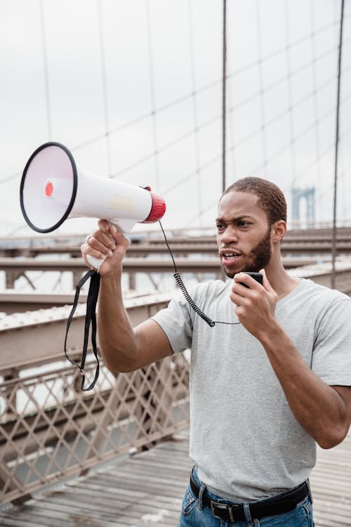 Free Protester holding a Megaphone Stock Photo