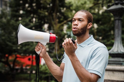 Free Male Protester holding a Megaphone Stock Photo