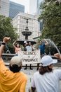 Protesters protesting in front of Water Fountain