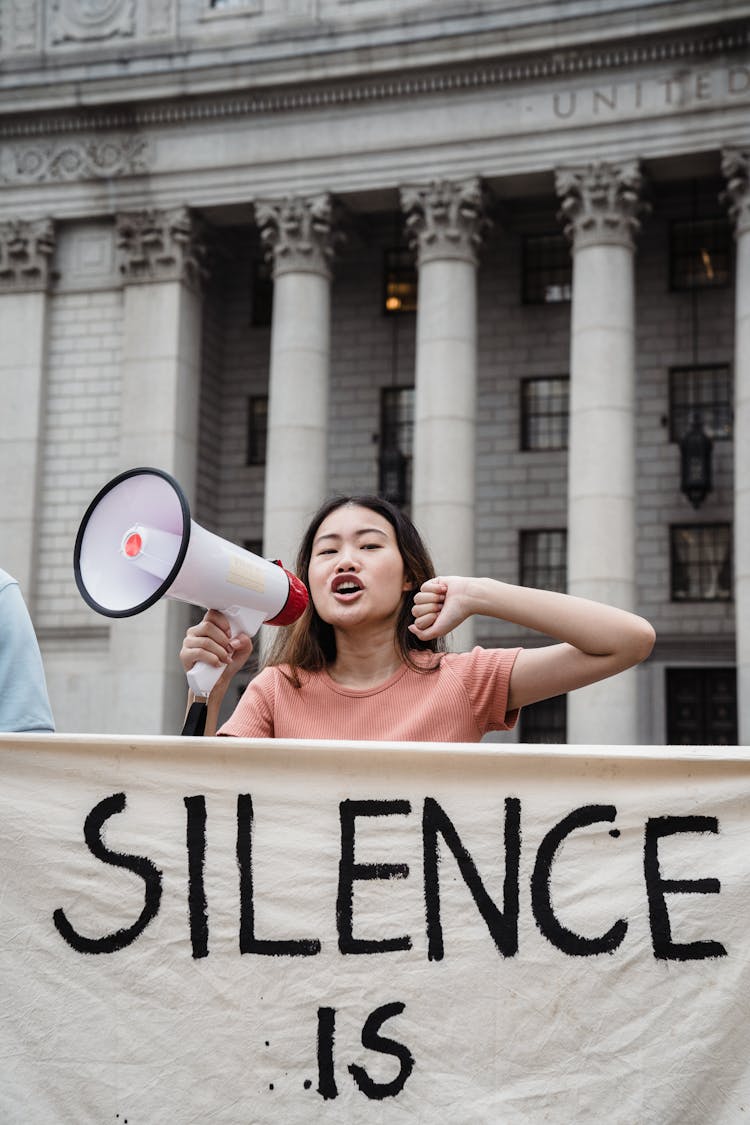 Female Protester Holding Megaphone