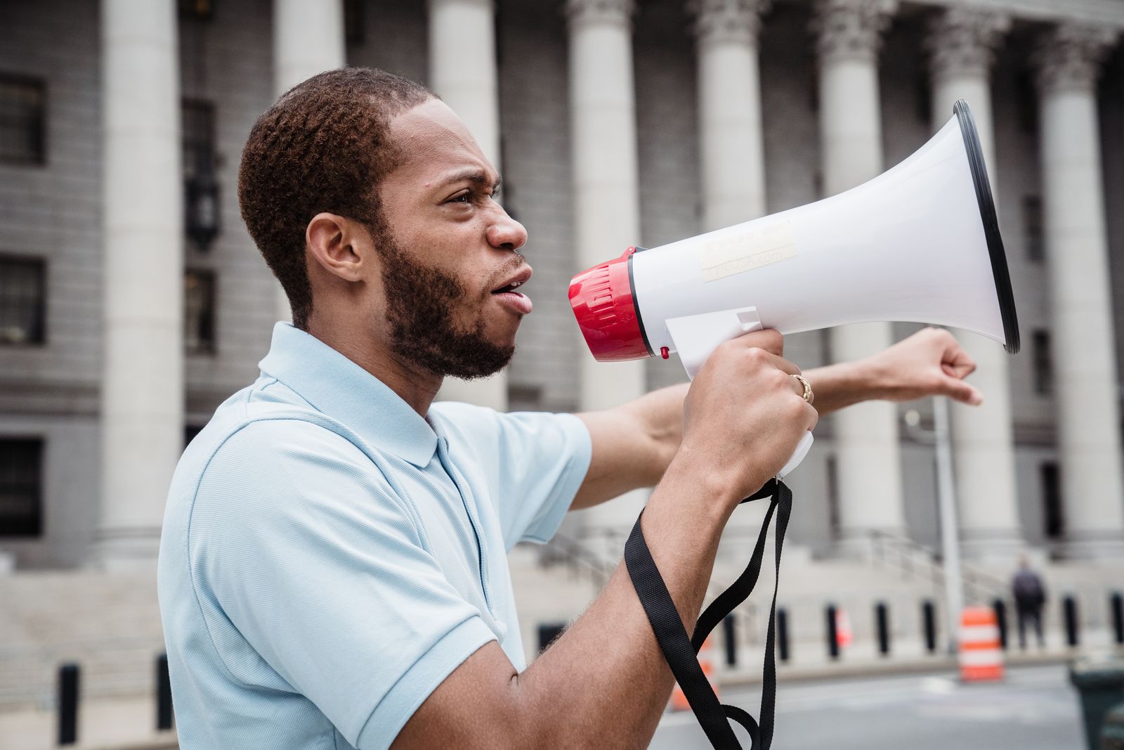 Megaphone in a crowd representing creator amplification and distribution spread