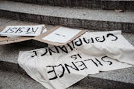 A close-up of protest signs reading 