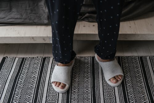 Person Wearing Blue and White Polka Dot Pants