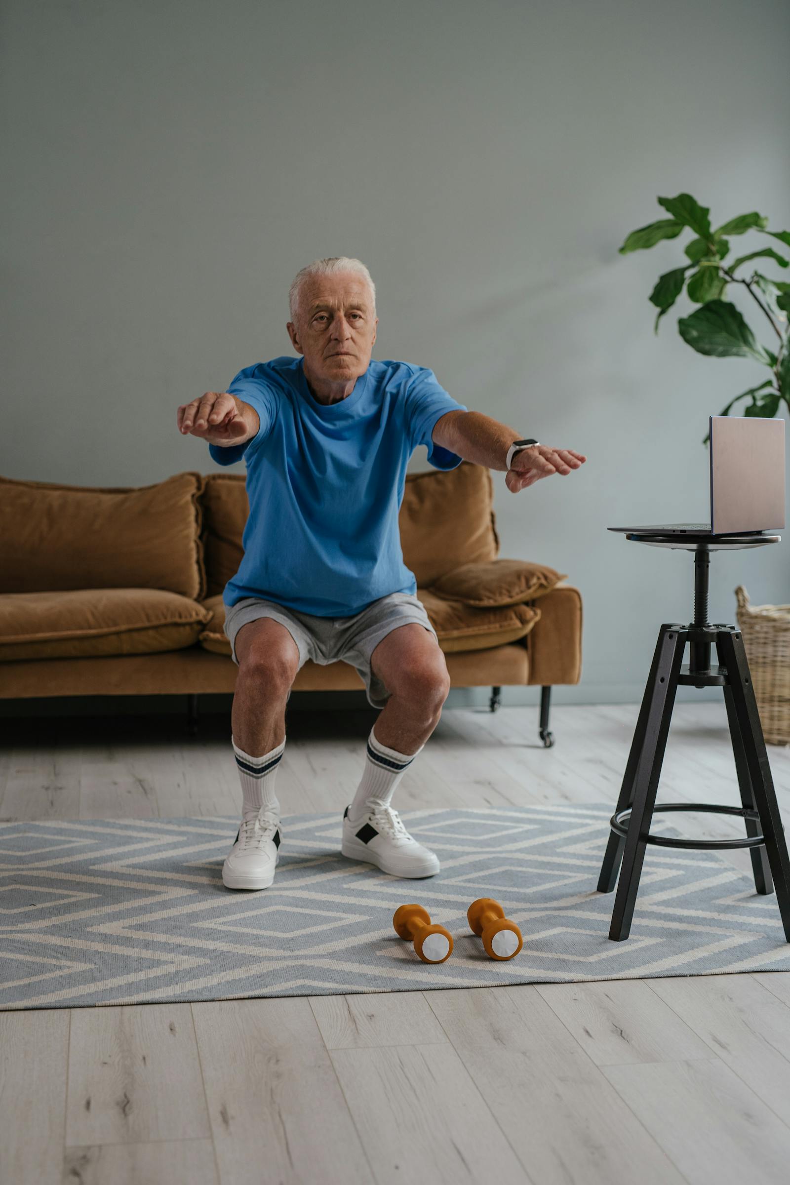 An Elderly Man With Dementia Exercising at Home