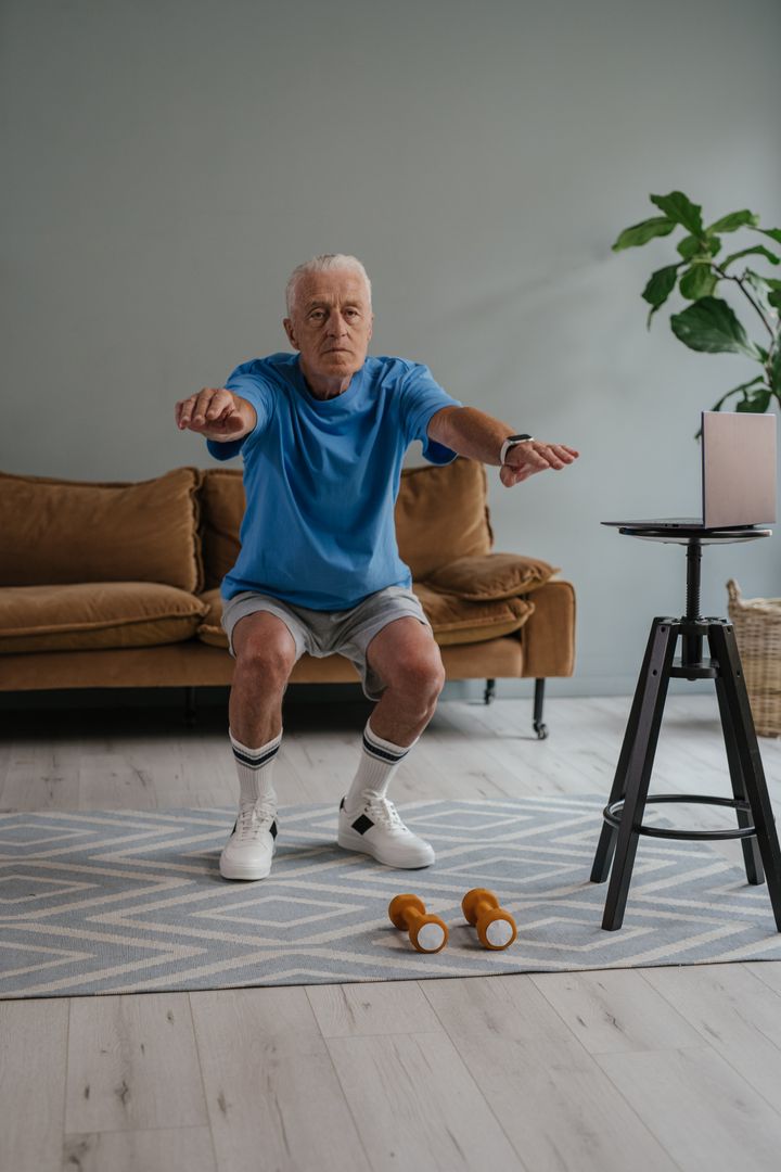 An older man training balance at home