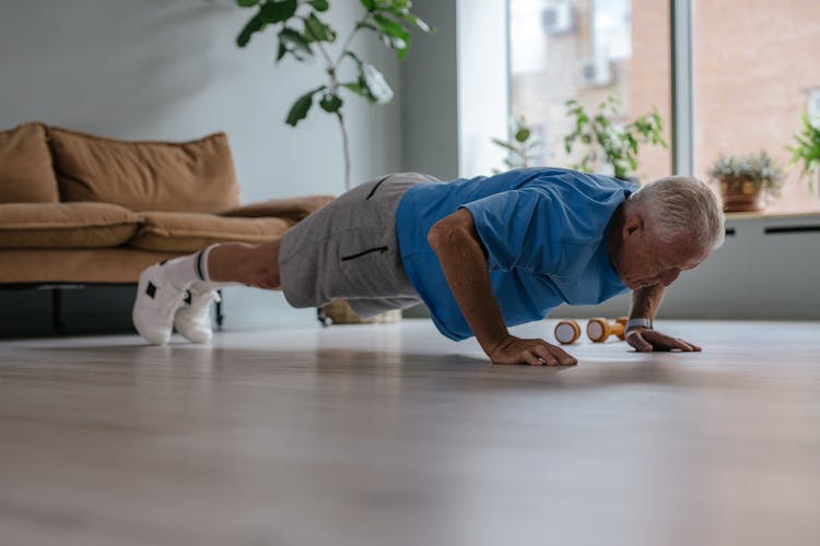 An Elderly Man Doing Push Ups 