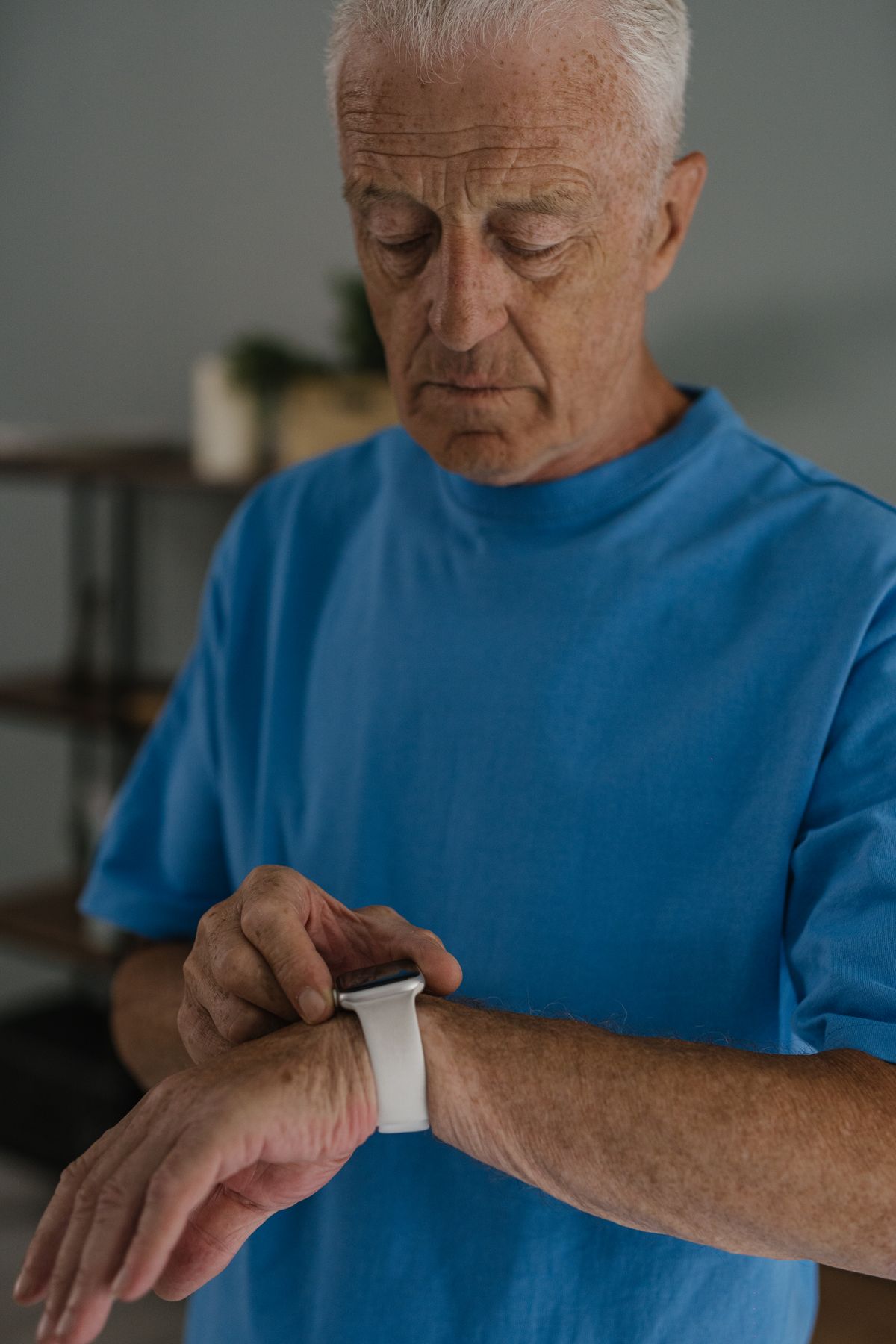 A smartwatch on a senior person's wrist