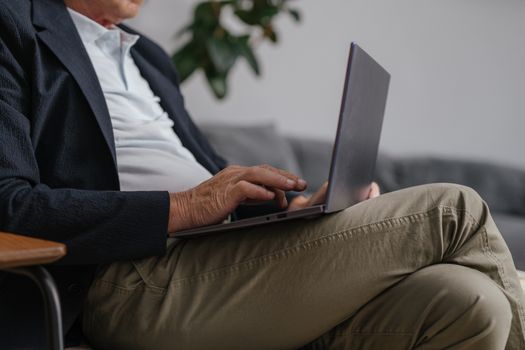 Man in Black Suit Jacket Using Macbook