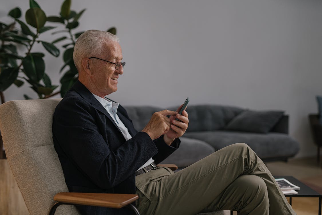 an elderly person looking at their phone