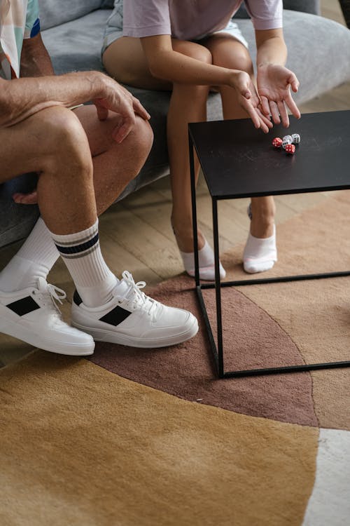 Woman Rolling the Dices on the Table 