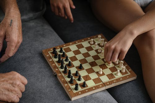 Free Close-Up Shot of People Playing Chess Stock Photo