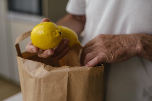 Free Person Holding Lemons Stock Photo
