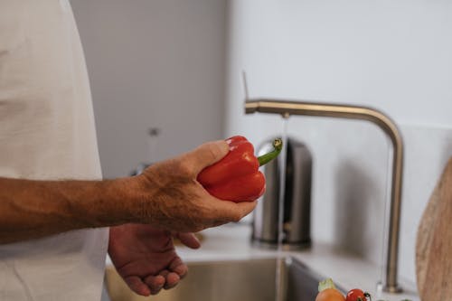 Free Person Holding Red Bell Pepper Stock Photo
