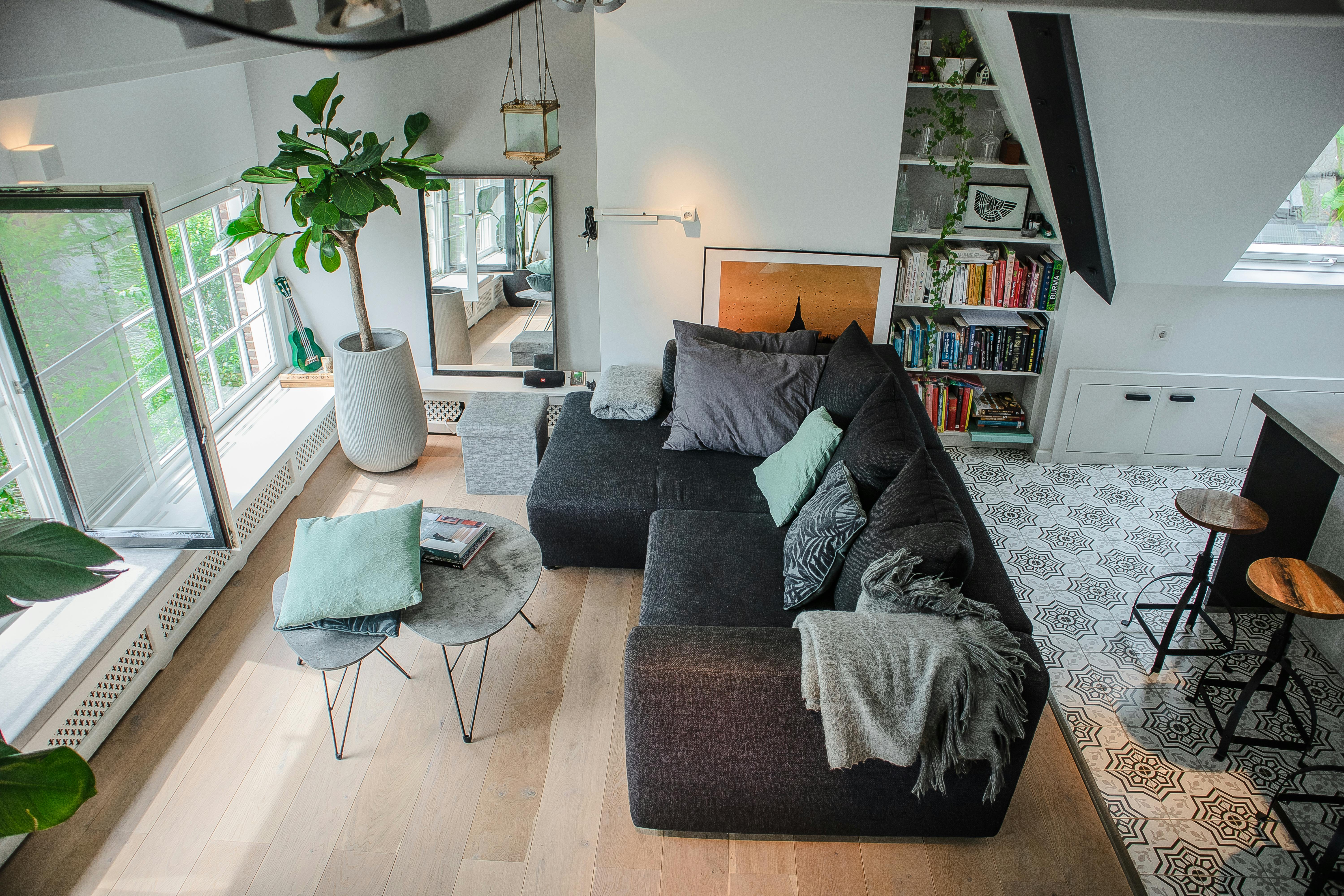 Black Sofa With Throw Pillows near Window · Free Stock Photo