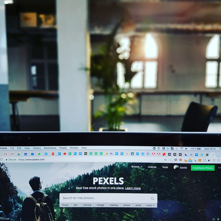 Website displayed on a computer in a modern workspace