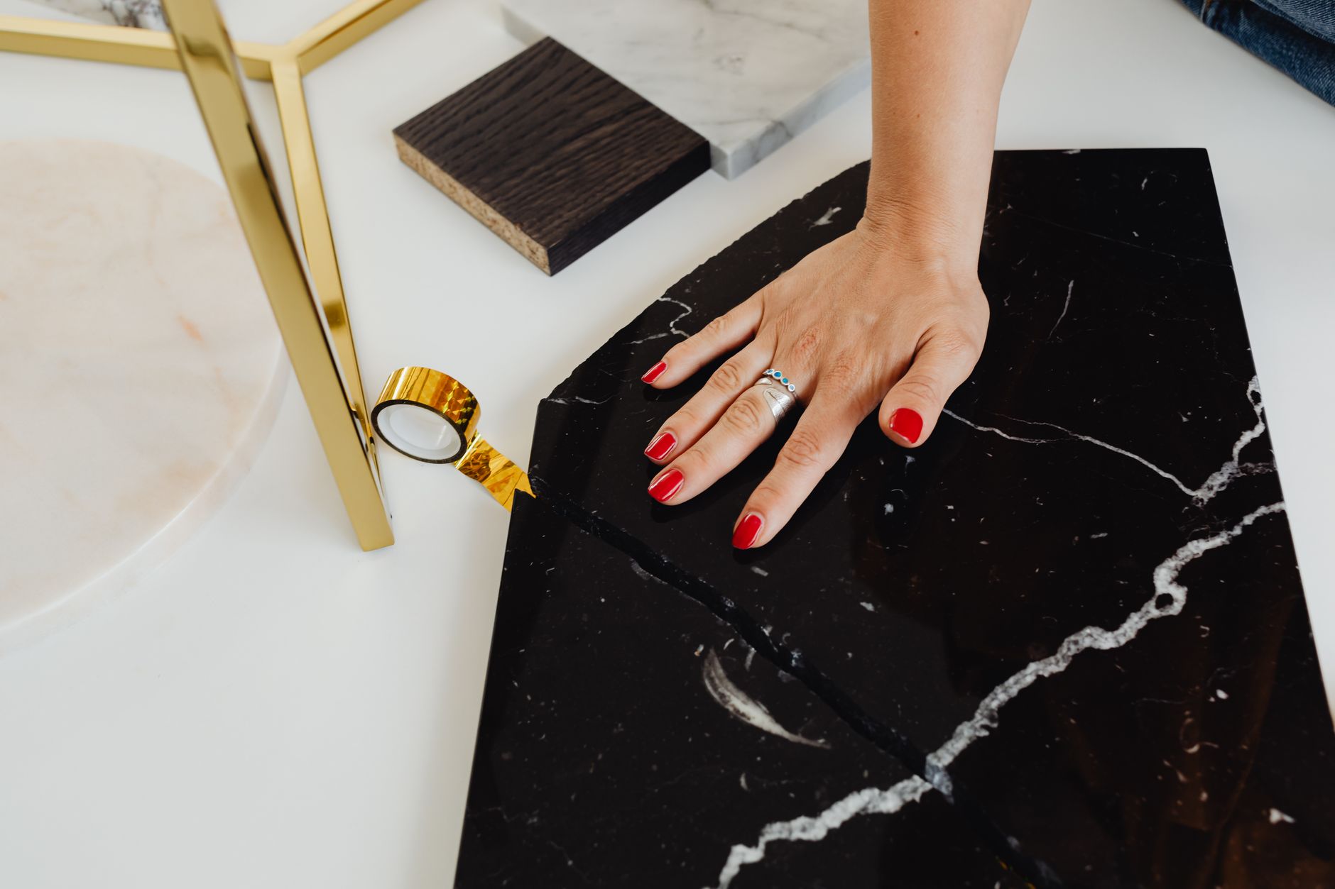 Private stylist reviewing bespoke luxury materials in an elegant studio
