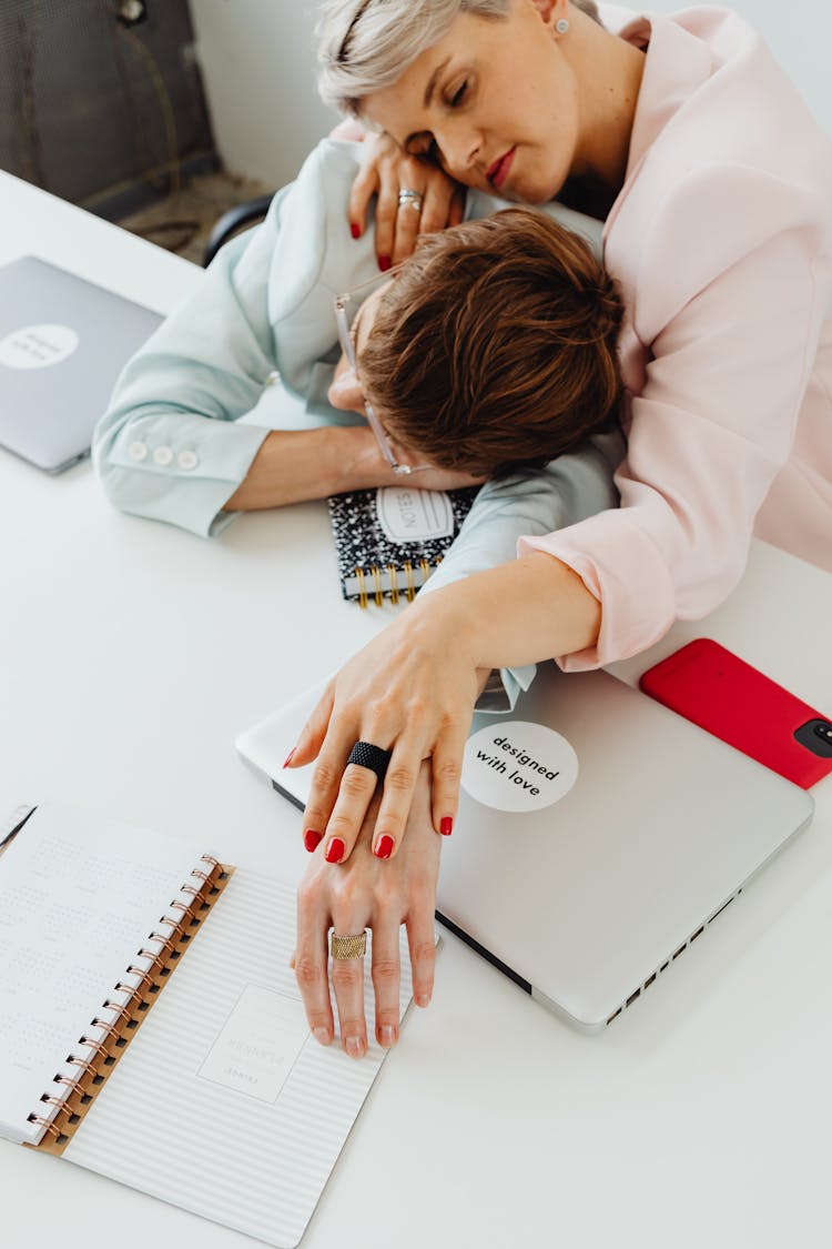 Exhausted Women In Business Attires 