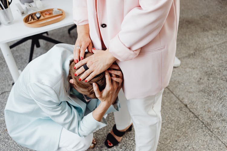 A Woman Consoling Another Woman