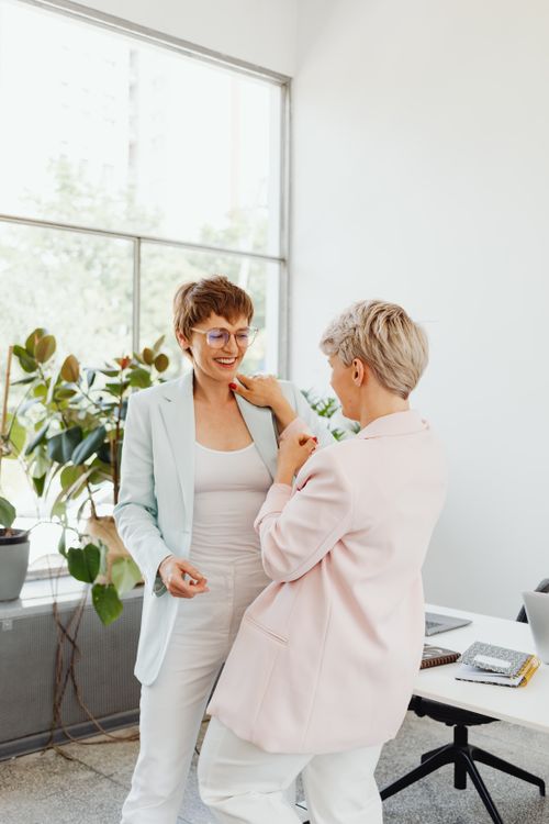 Free Two businesswomen in discussion at a modern office with natural light. Stock Photo