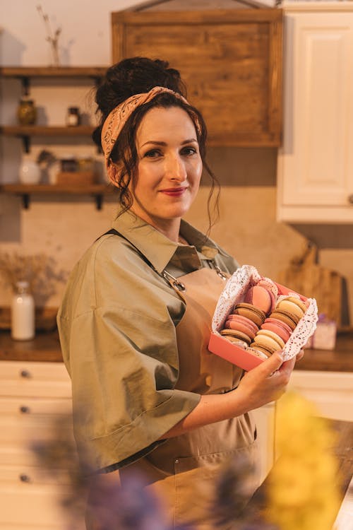 Woman Holding a Box of Macaroons