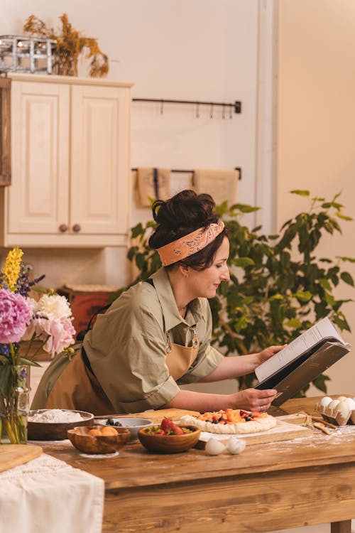 A Woman Reading a Cookbook