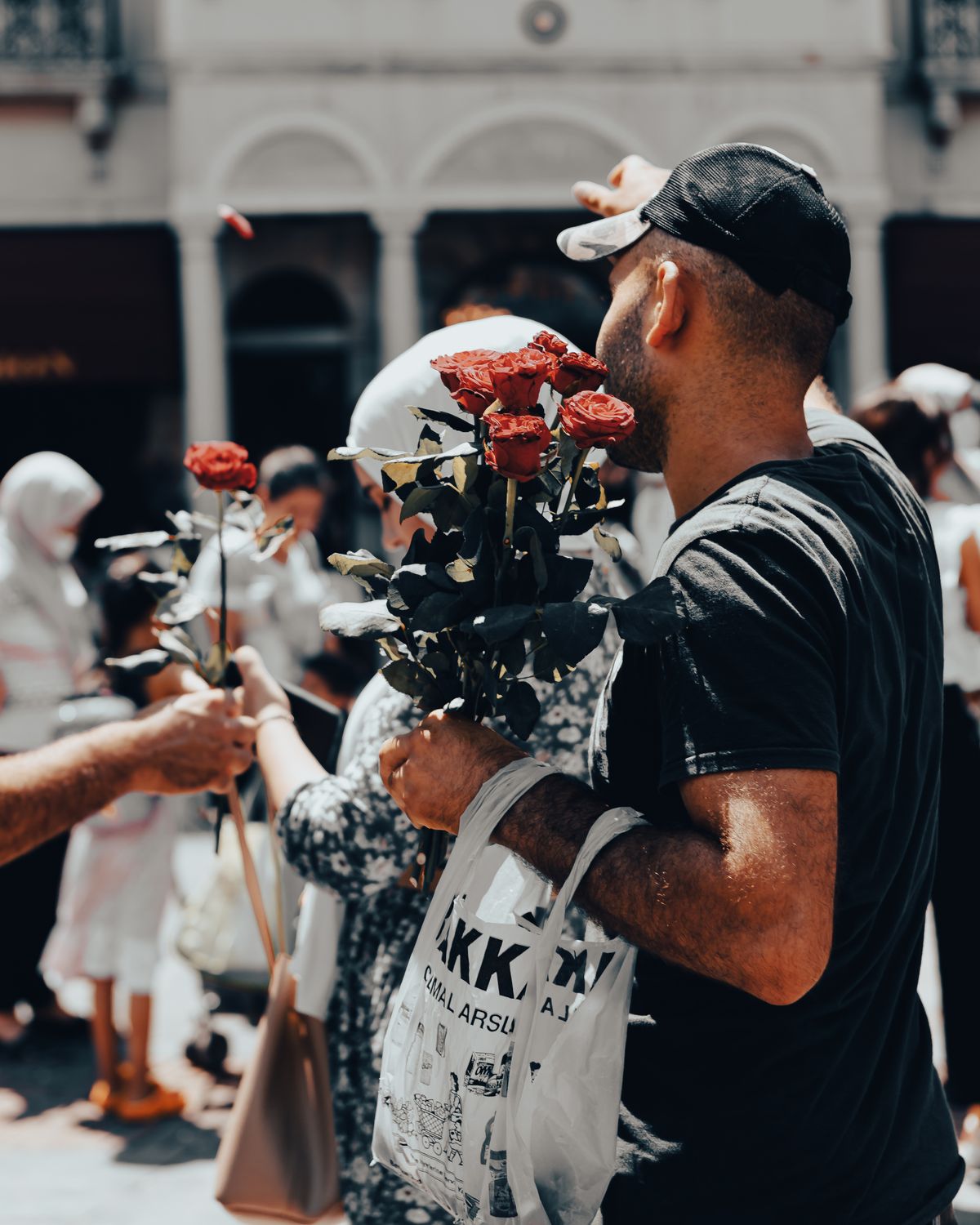 Man Carrying Roses A Man Holding Red Roses · Free Stock Photo