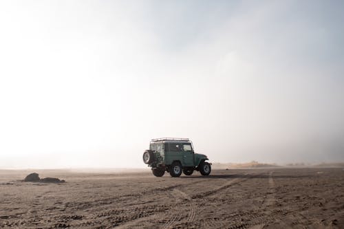 Land Cruiser on Desert Land Under White Sky