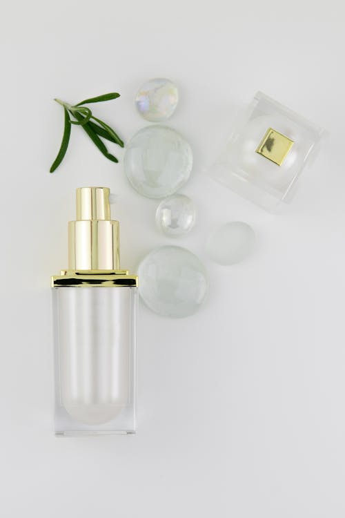 Free Empty Perfume Bottles Besides Glass Crystals Stock Photo