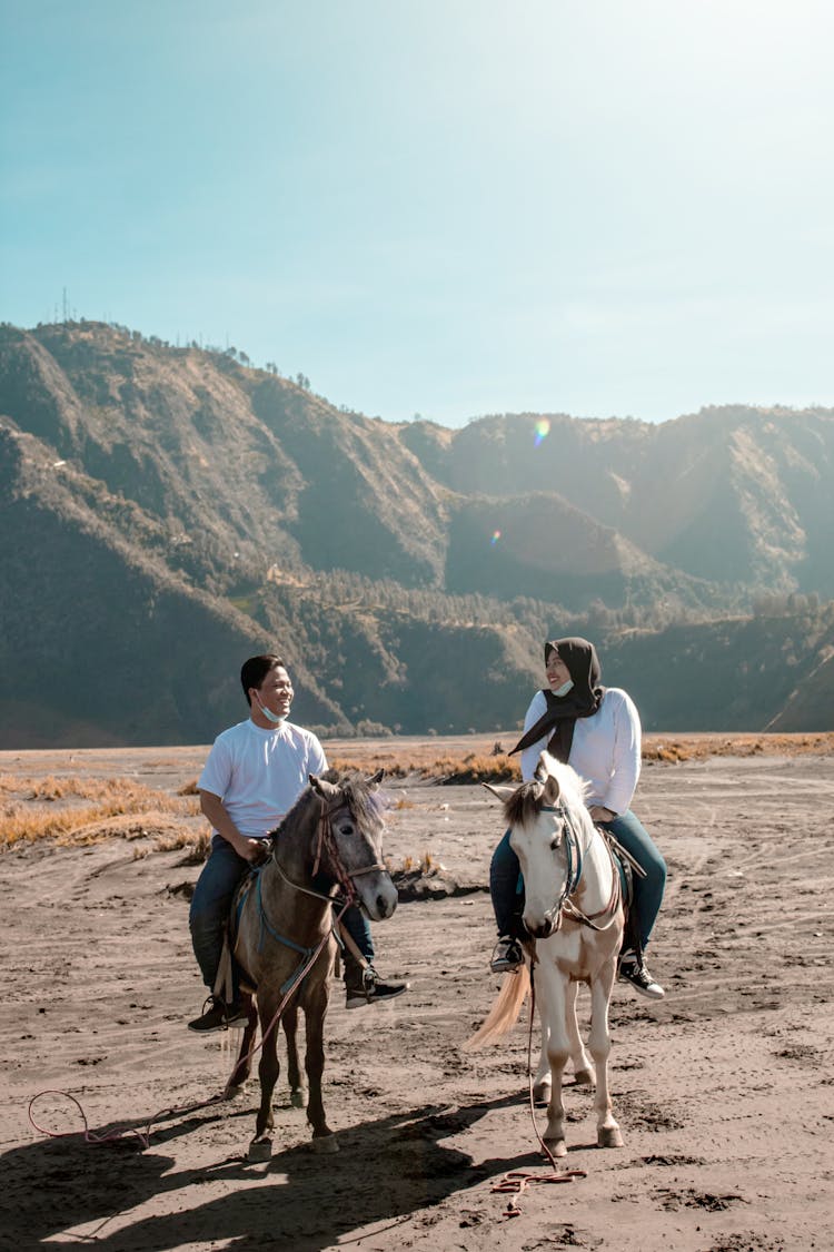 Couple Riding Horses