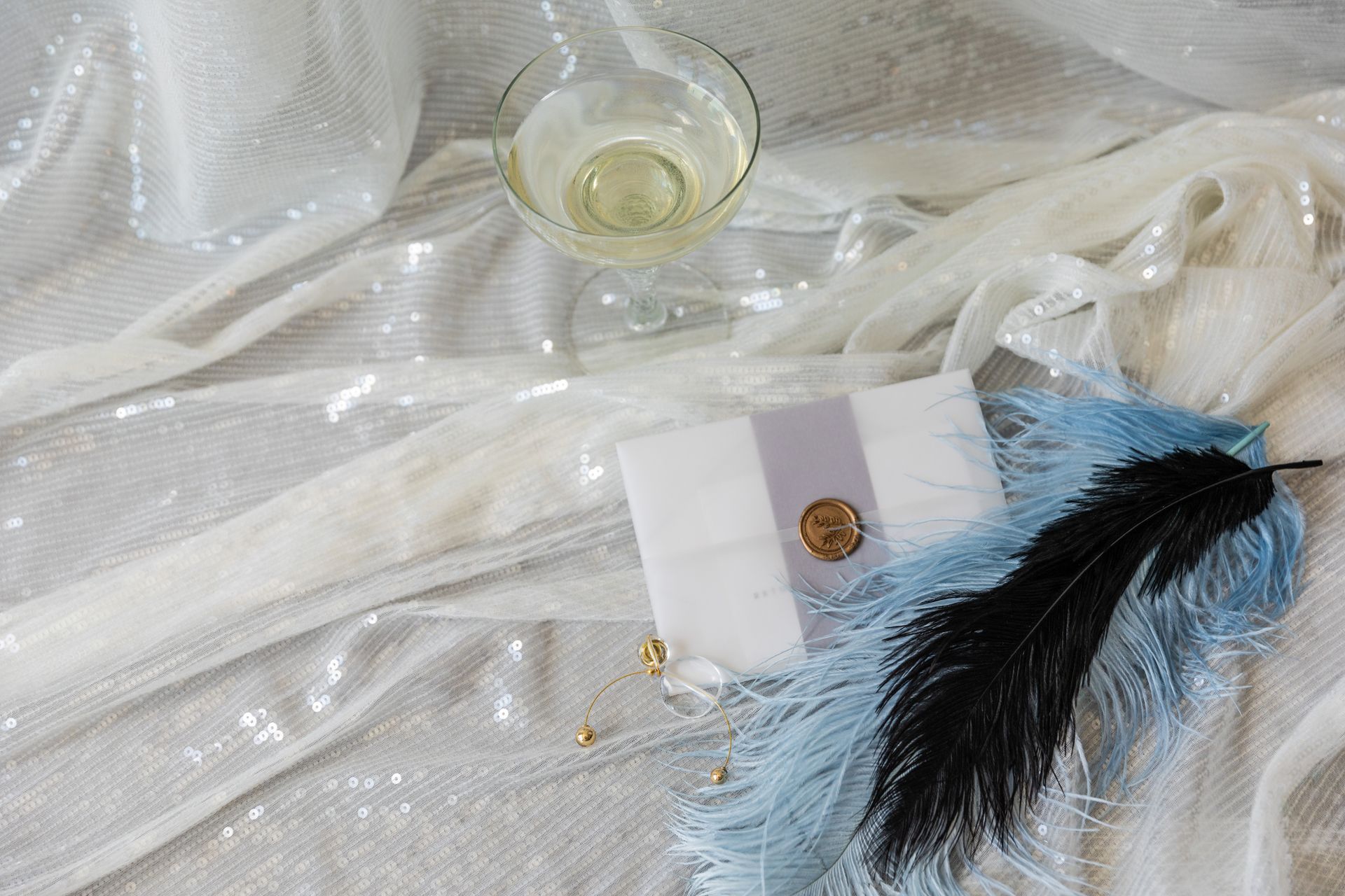 Letter and Champagne on White Textile Background