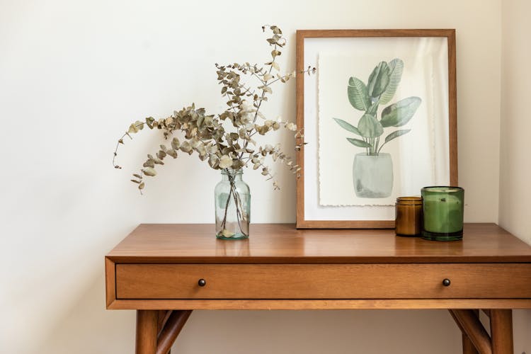 Plant And Drawing On Table