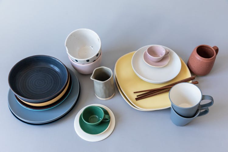 Ceramic Dinnerware On Blue Surface