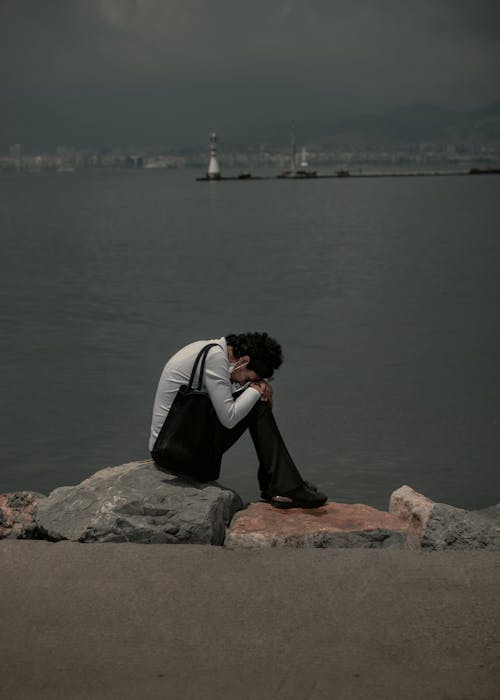 A Woman Sitting by the Sea