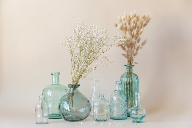 Brown Dried Leaves In Clear Glass Bottles