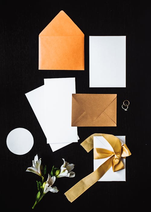 Free White and Brown Paper on Black Surface Stock Photo