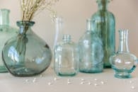 Three Clear Glass Bottles on White Table