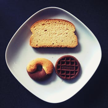 Toasted Bread, Donut, and Chocolate on Top of White Ceramic Plate