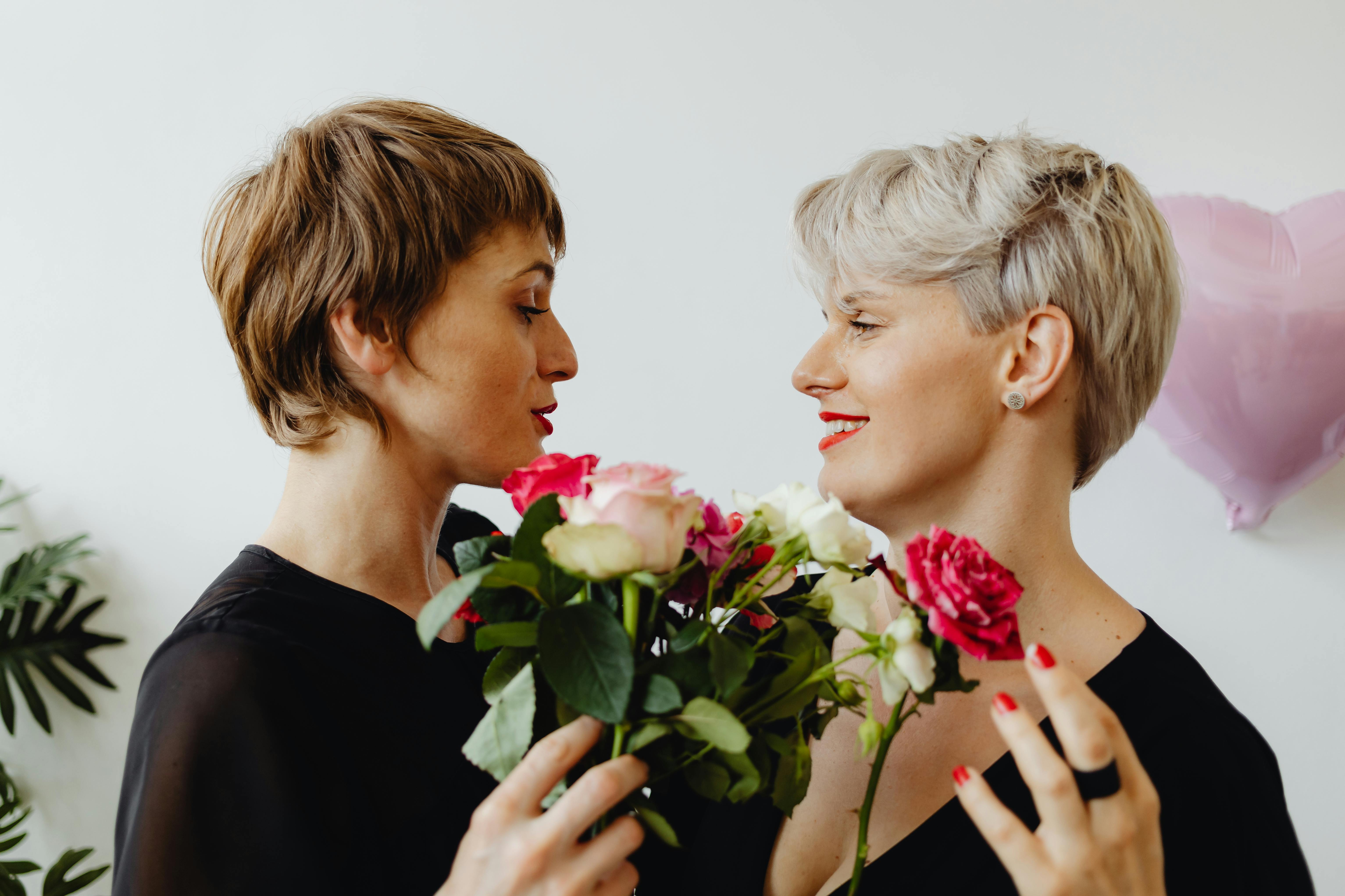 close up photo of women facing each other