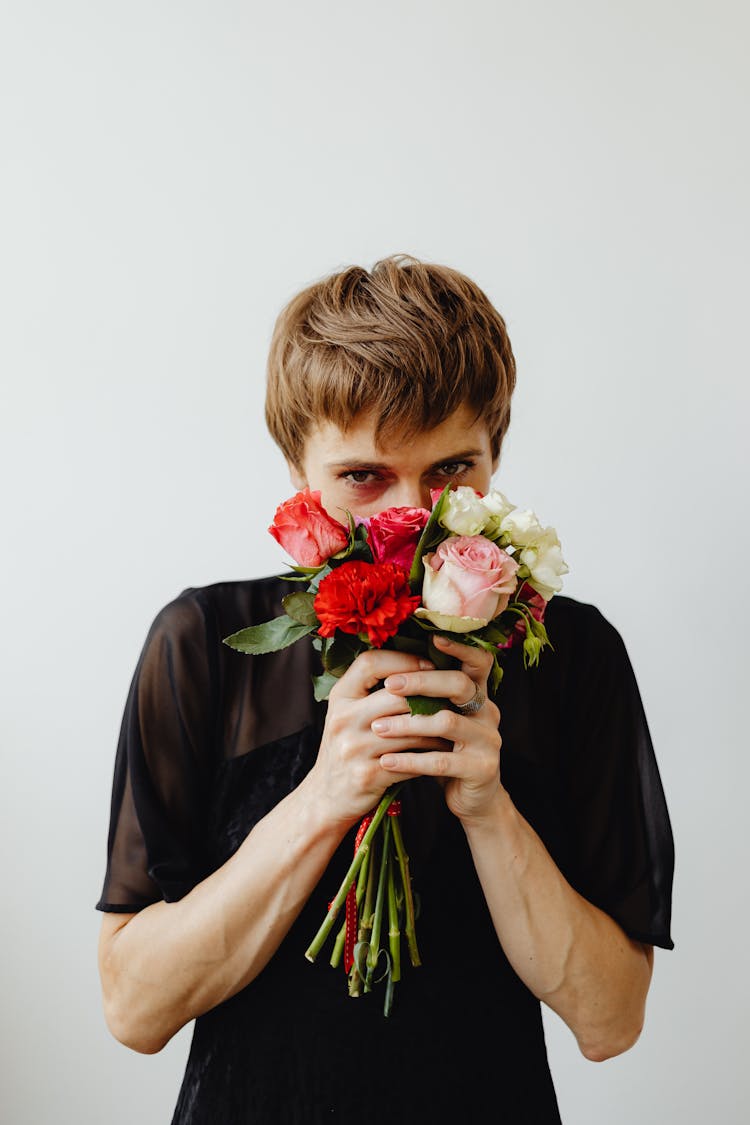 A Woman Holding Flowers