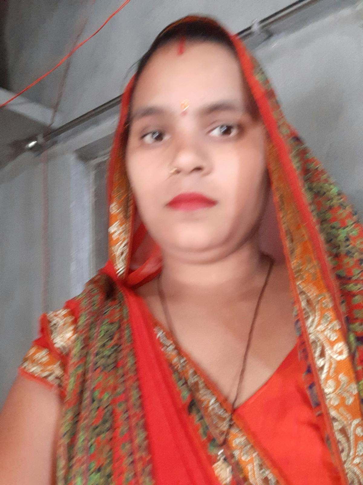 Creamy yogurt sauce with herbs in a bowl with a spoon